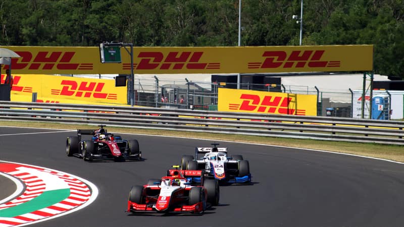 High-speed motorsport race at Hungaroring in Mogyoród, showcasing dynamic F2 racing action.